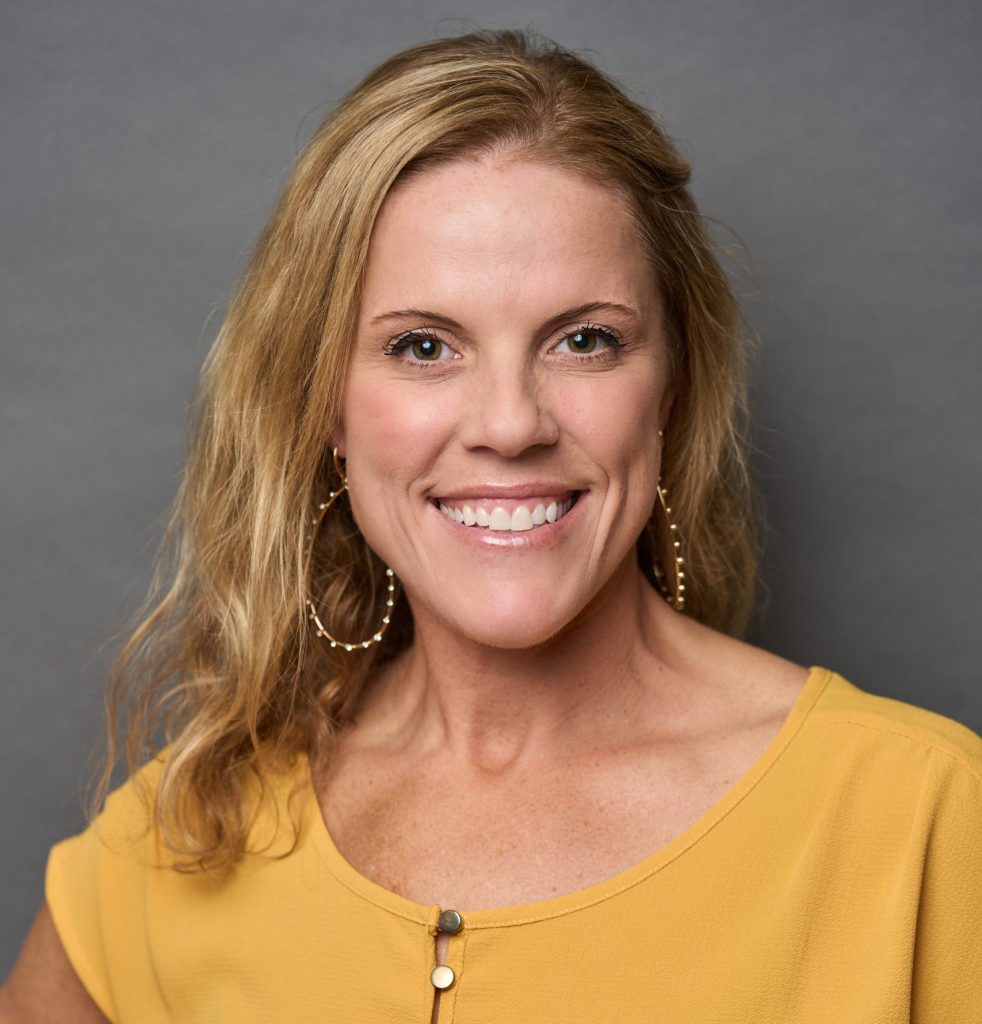 woman smiling in yellow shirt, Rebecca graves is an emdr therapist for men, executive coach for men, Leadership Keynote Speaker in Los Angeles